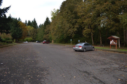 Paved parking lot has access to trails, picnic shelter, accessible restrooms and off leash dog park Paved parking lot has access to trails, picnic shelter, accessible restrooms and off leash dog park